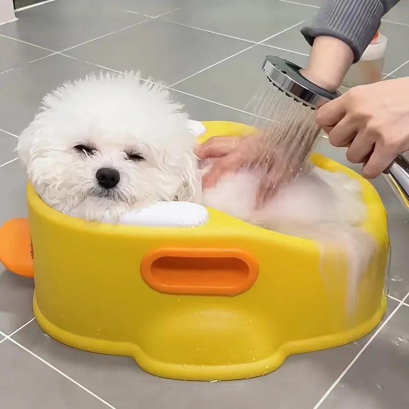 Blue duck-shaped PVC bathtub for washing small dogs and cats on a plain background.