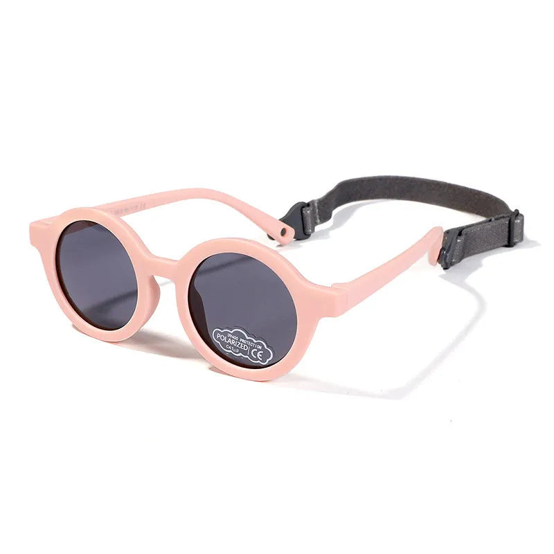 Soft silicone round-frame sunglasses for babies and toddlers aged 0-3 years with polarised UV400 lenses.