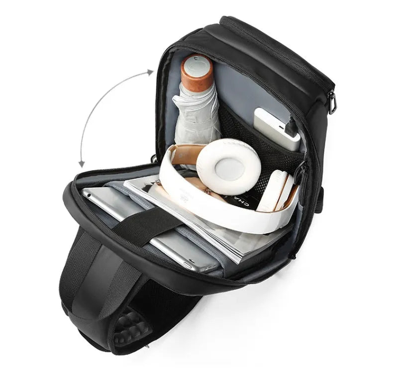 Black PVC outdoor shoulder bag with air cushion strap showing internal computer pocket and organisational compartments