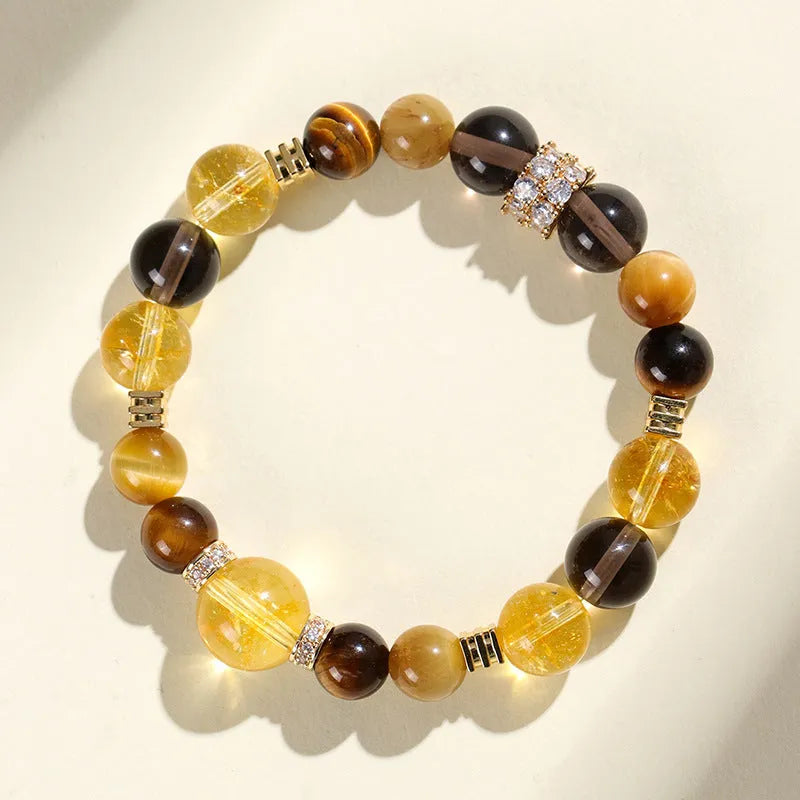 Natural yellow women's bracelet with 10mm artificial crystal string beads on a wrist.