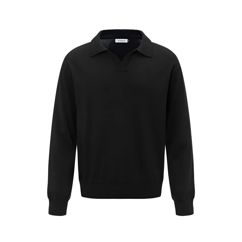 Man wearing a loose fit black pullover sweater for casual leisure wear.