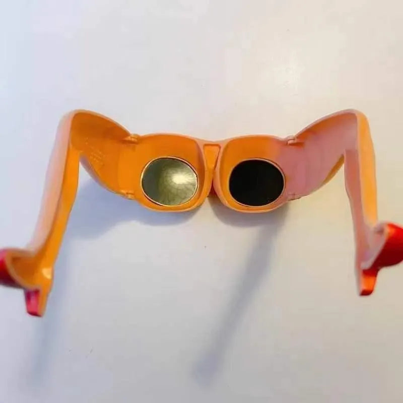 Orange personality sunglasses with leg and hip novelty design on plastic frames