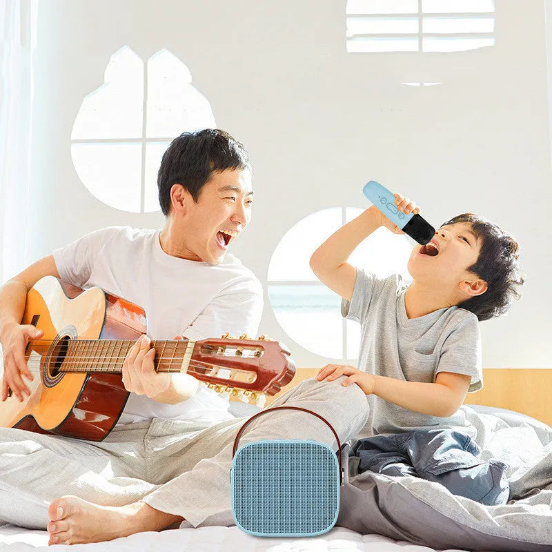 Compact portable Bluetooth speaker with microphone in white, pink, or blue plastic casing