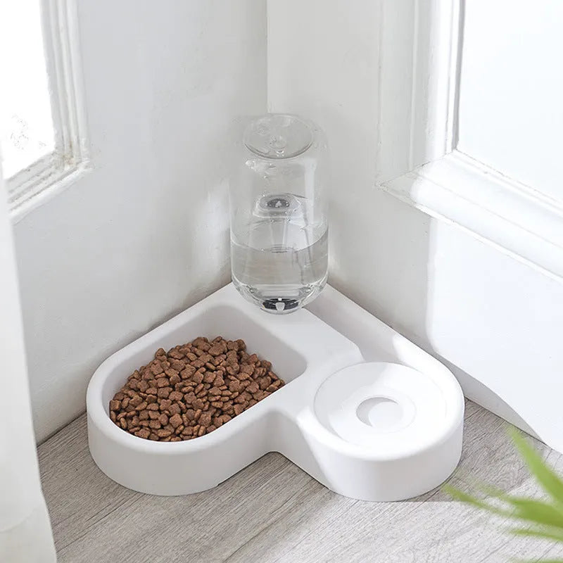 White automatic pet water fountain for cats and dogs on a floor.