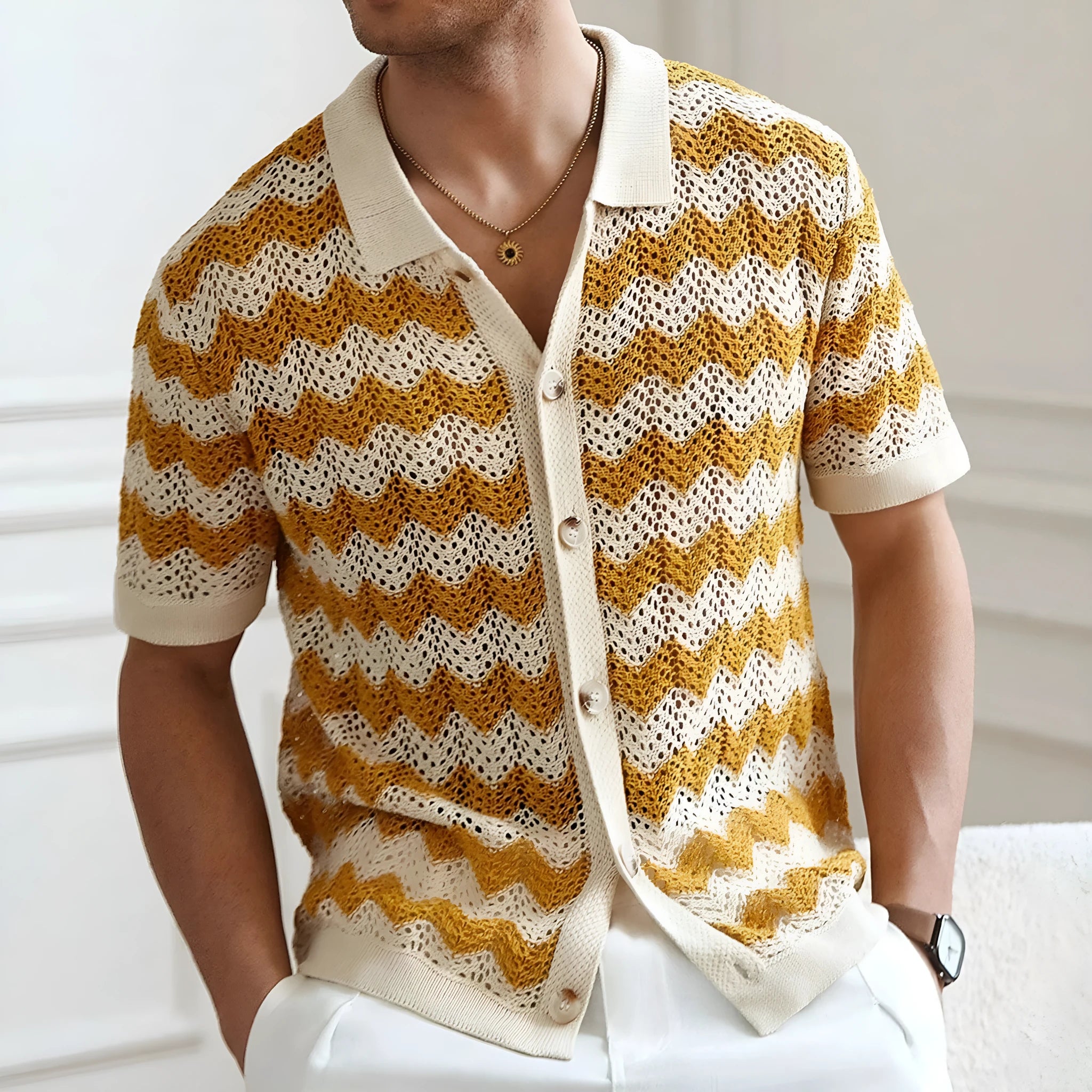 Yellow hollow jacquard corrugated short sleeve sweater with flocking detail on a hanger.