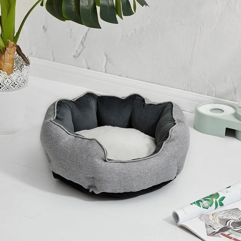 Blue octagonal pet bed for small dog with high sides and removable interior mat.