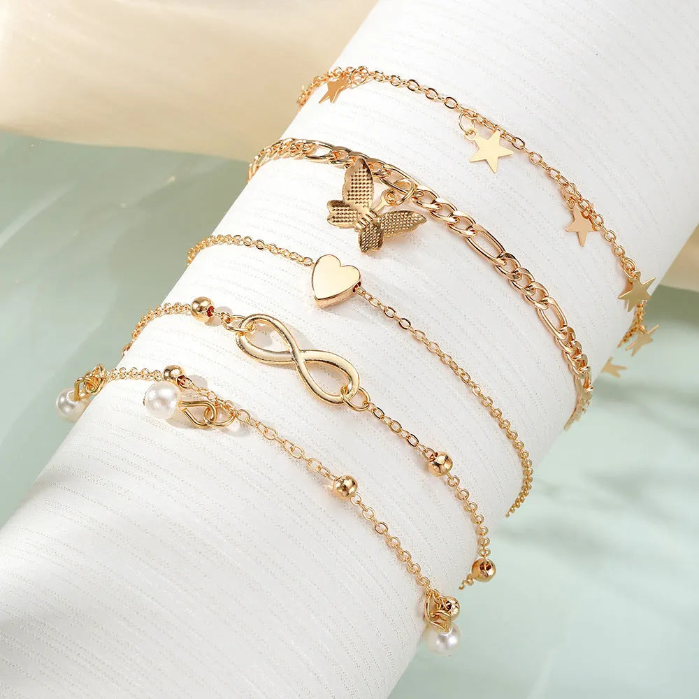 Four-piece butterfly pearl heart anklet set with layered alloy foot chains