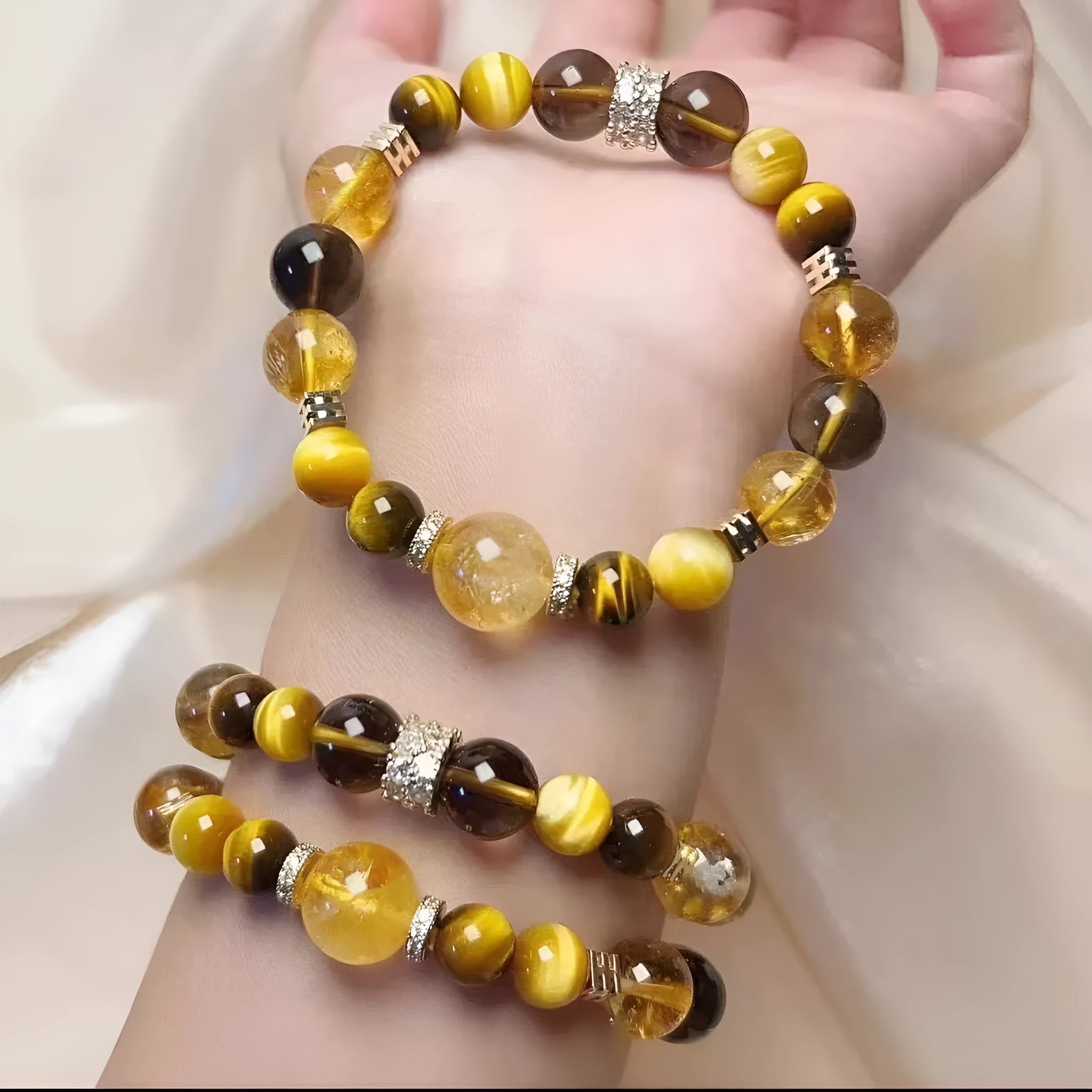 Natural yellow women's bracelet with 10mm artificial crystal string beads on a wrist.