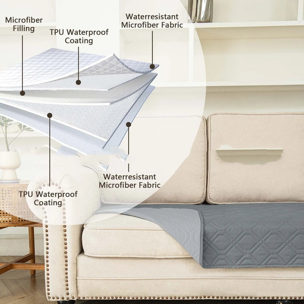 Double-sided waterproof dog sofa cushion in dark grey and light grey reversible colours on a sofa