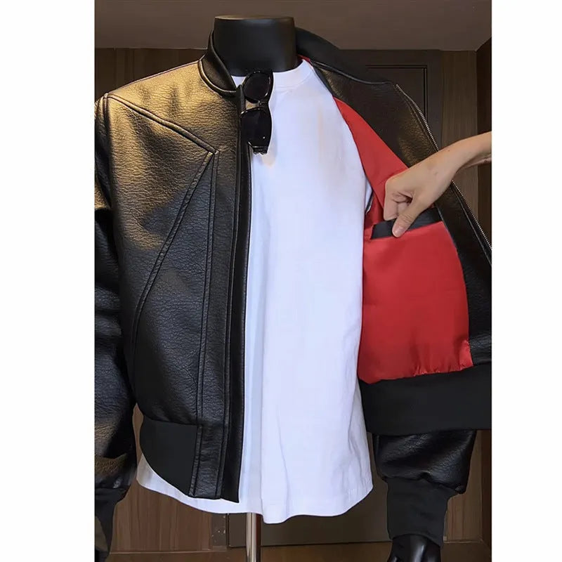 Men's black extended length PU leather jacket with litchi grain texture, shown in a tight business fit.