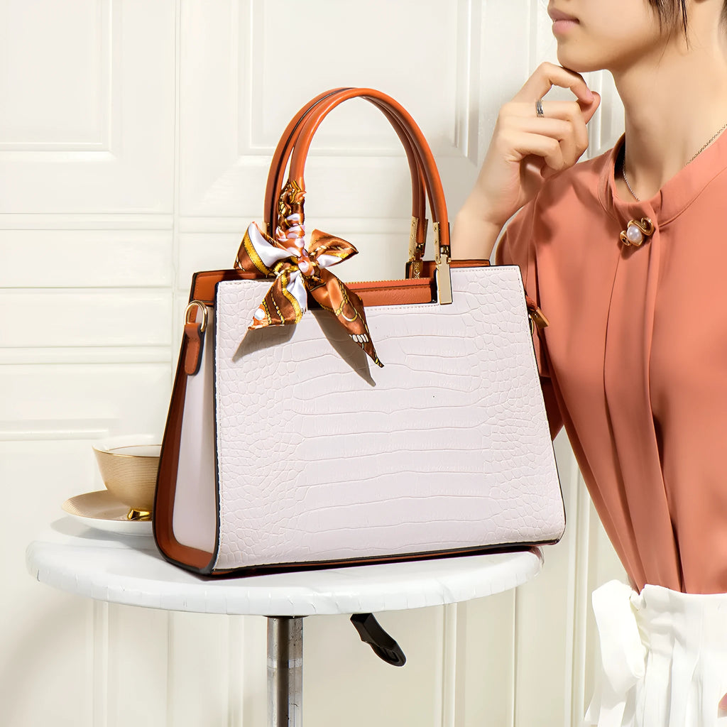 Milky white women's PU leather shoulder handbag with interior organisation pockets in horizontal square shape.