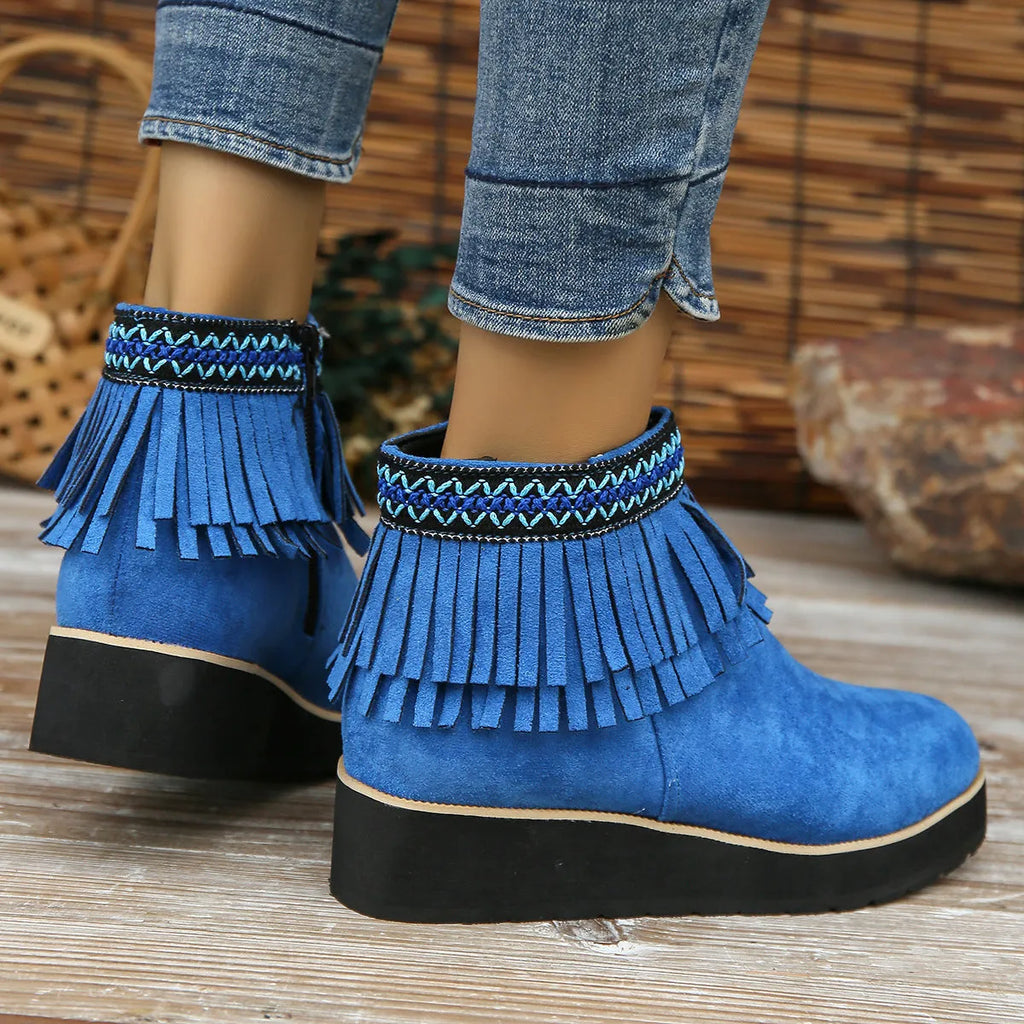 Women's black suede wedge ankle boots with a thick platform sole and side zipper.