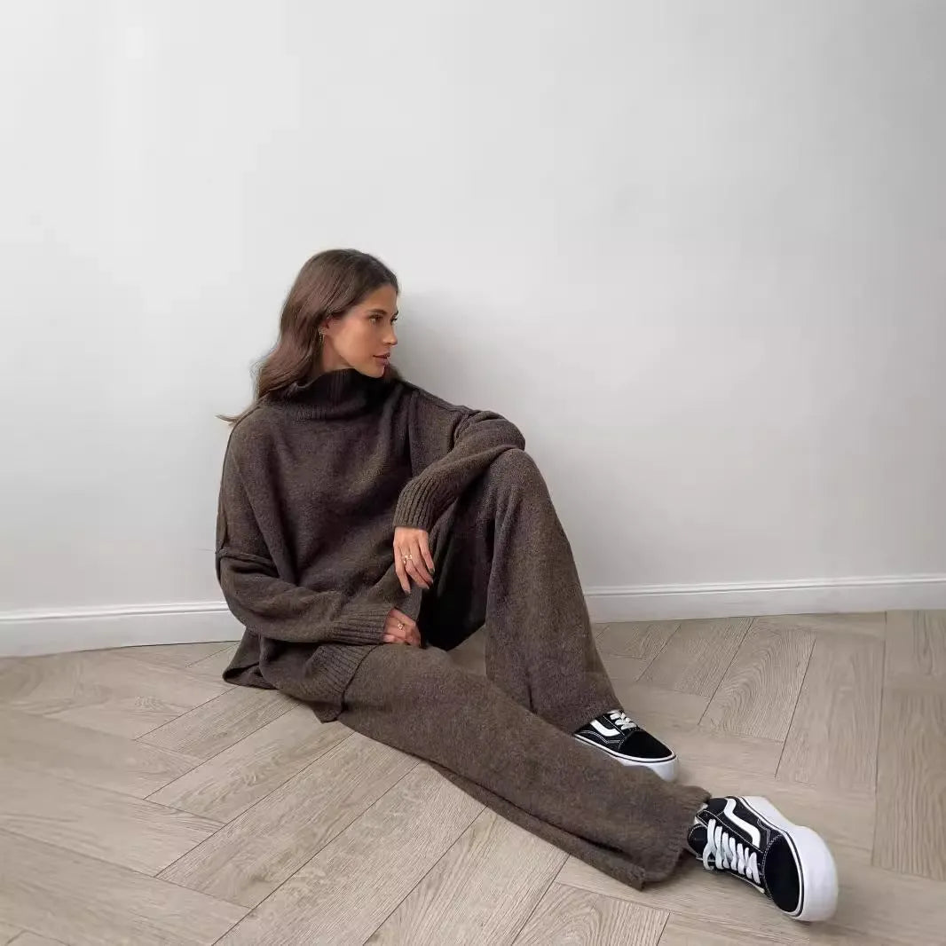 Women's dark grey acrylic sweater suit with side slits and matching trousers