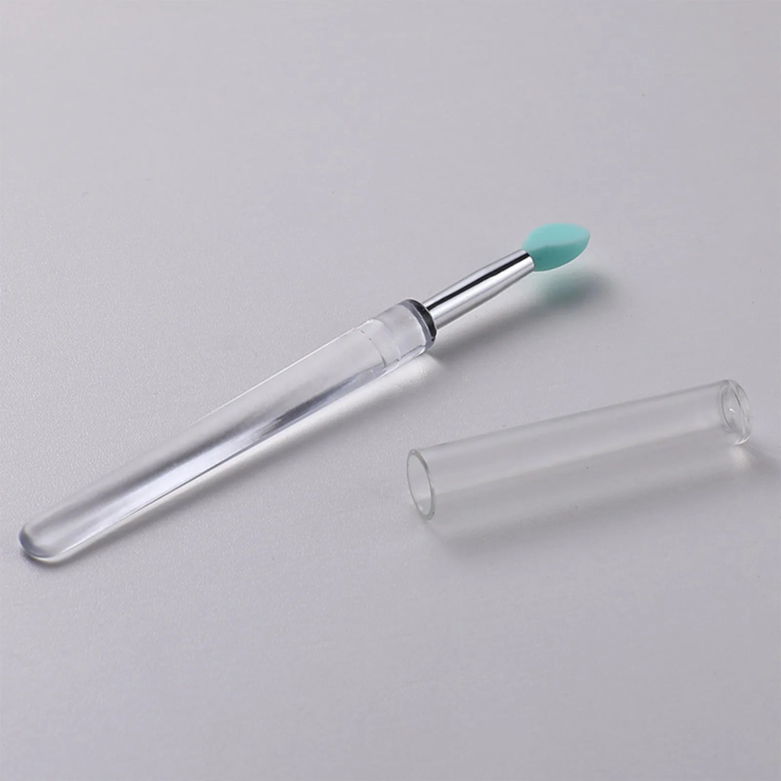 Set of reusable silicone lip brushes with protective caps in various colours