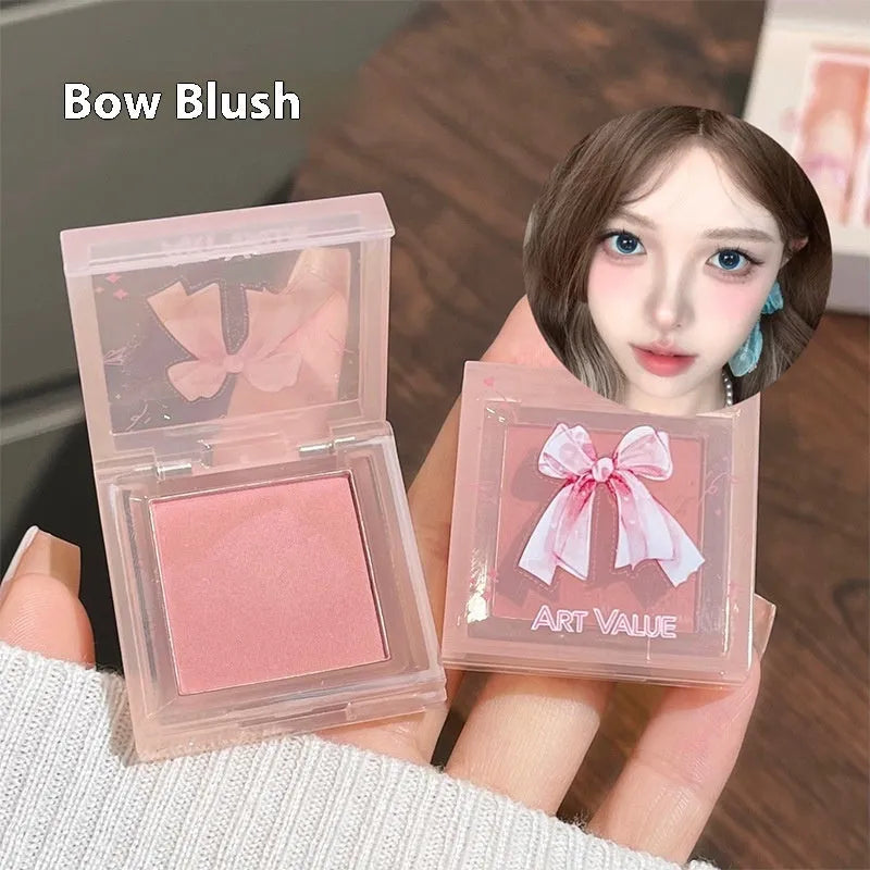 Butterfly Box makeup set containing four pink lip muds, powder blusher and necklace in butterfly packaging