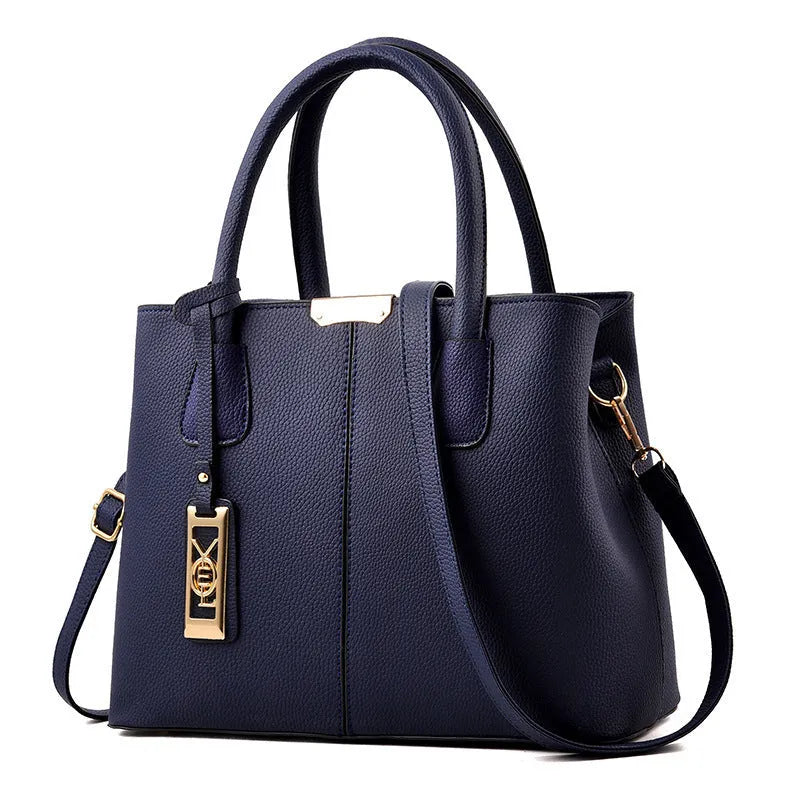 Soft large capacity PU leather shoulder bag in a horizontal square shape with a leather strap.