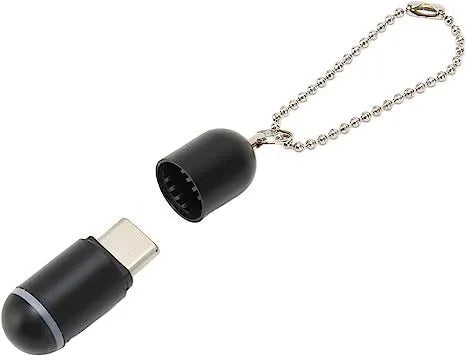 Small black capsule infrared remote emitter for smartphone Lightning, Type-C, and Micro-USB ports.