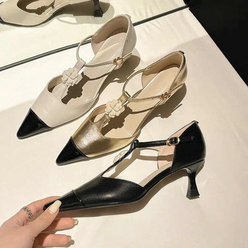Women's black stiletto heel pointed toe shoes with floral decoration and buckle details