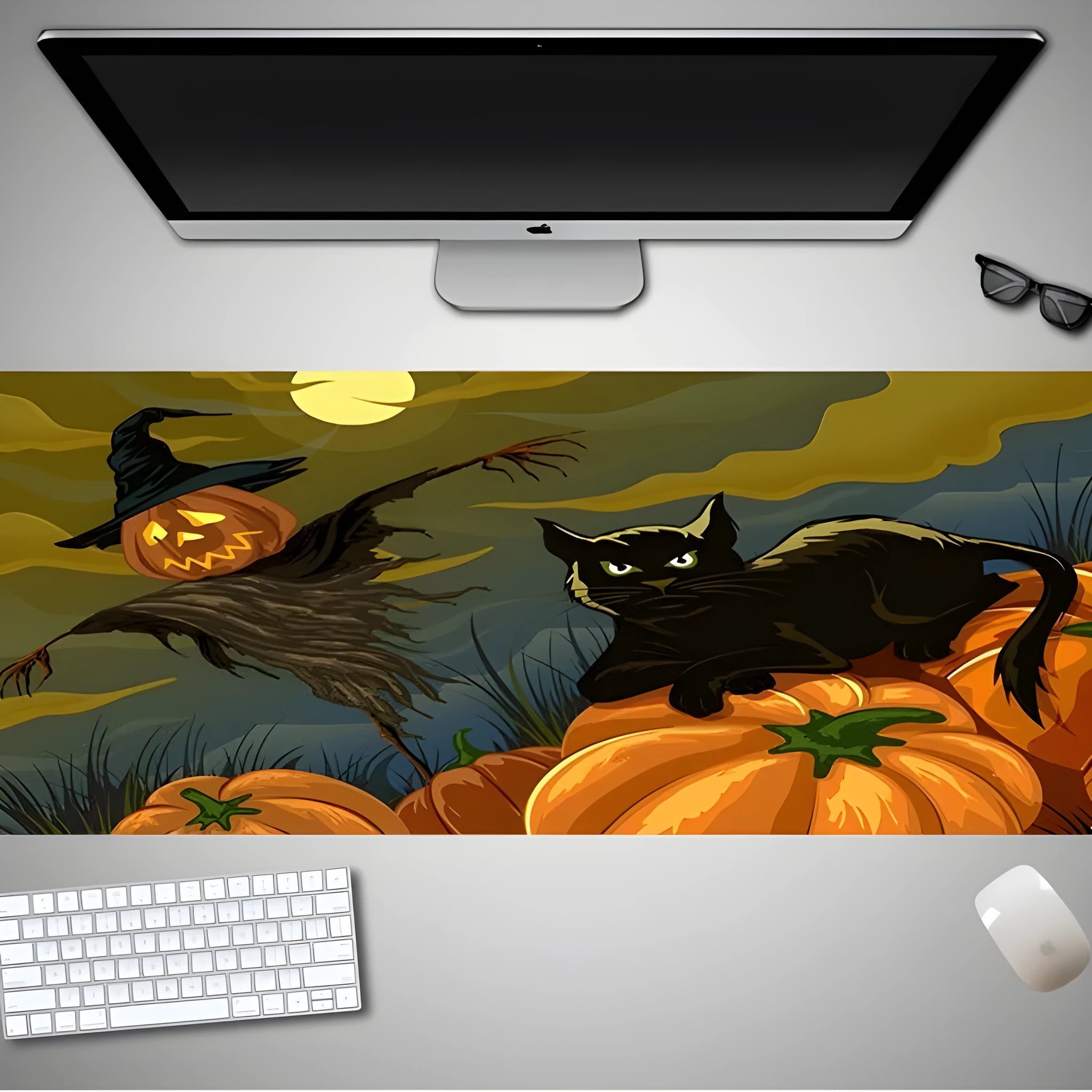 Oversized Halloween-themed rubber cloth mouse pad with non-slip base on a desk.