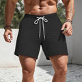 Man wearing loose-fit solid colour polyester casual shorts in a straight-leg design