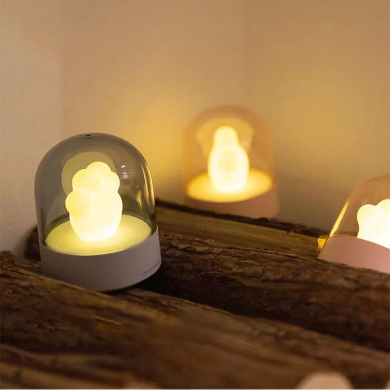 Grey cat paw shaped USB rechargeable night light with music box and rotating soft light