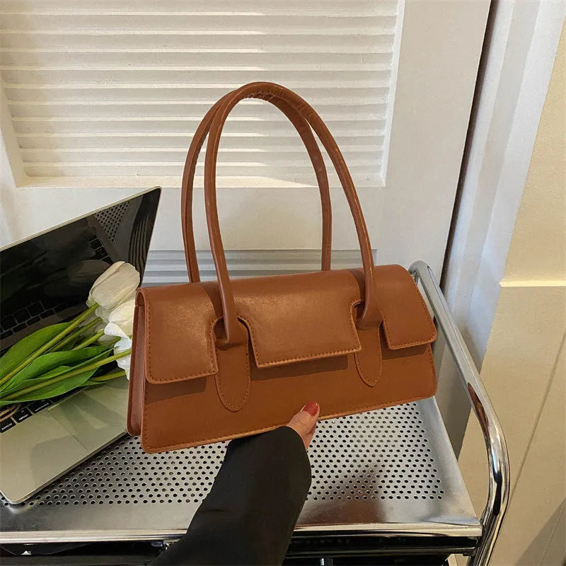 Women's black PU leather square shoulder bag with single strap and stitching details