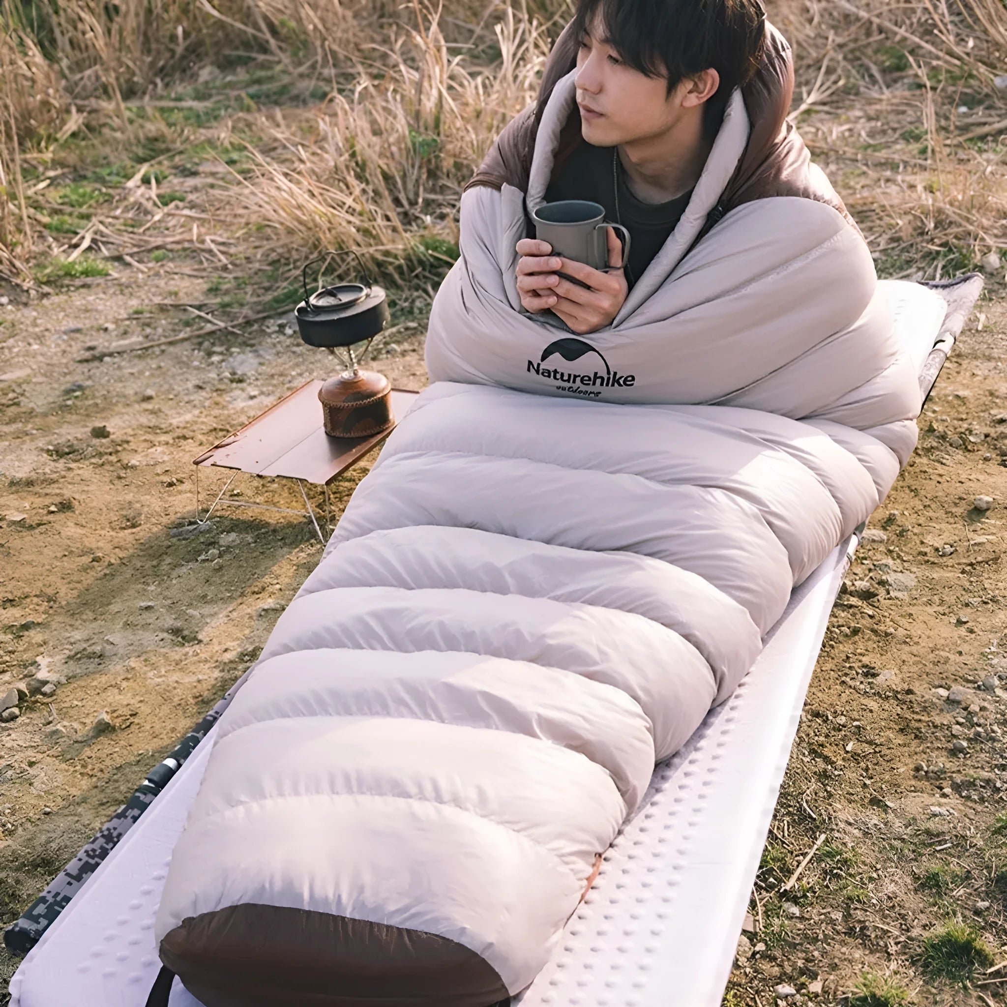 A mummy-style sleeping bag with a storage bag, filled with goose down, available in multiple size and weight configurations.