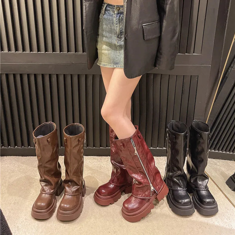 Women's black platform muffin pants Martin boots with high socks and a square rubber heel.
