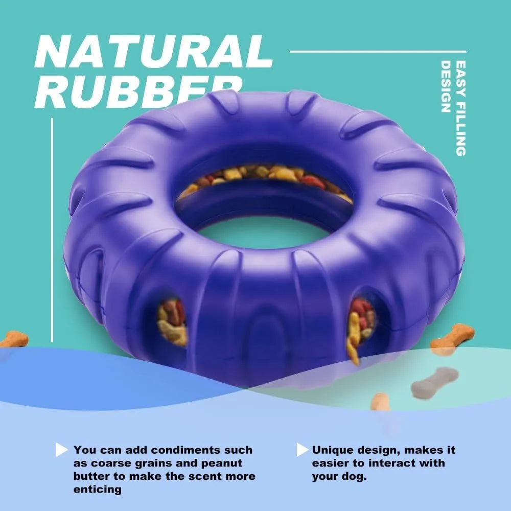 Blue natural rubber tyre-shaped dog chew toy with oval openings for treat dispensing.
