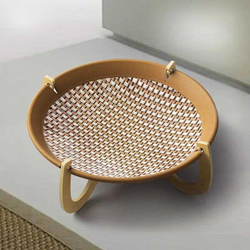 Brown woven rattan square pet hammock bed for cats and dogs, elevated off the ground.
