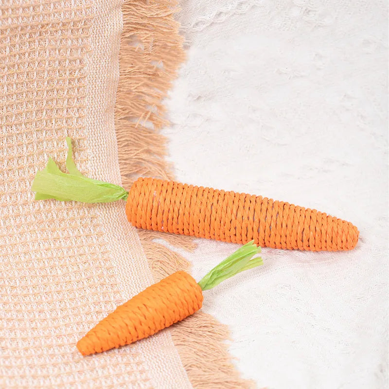 Cat toys bundle with paper crinkle toys, plastic ringing stones, carrot-shaped chews, and grinding sticks