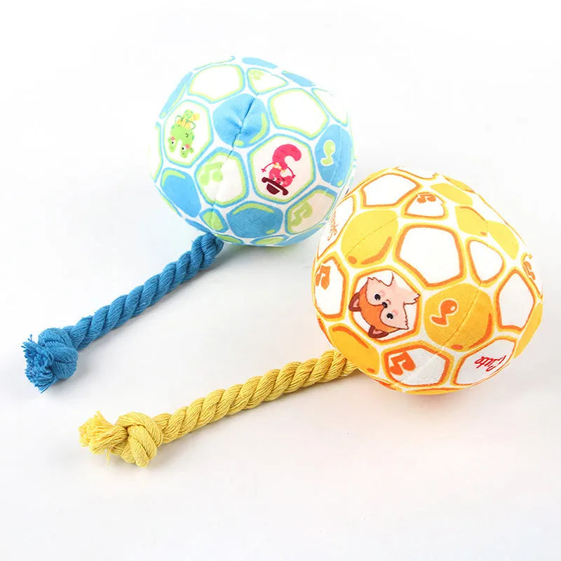 Elastic football design dog toy with cotton rope exterior and squeaker ball