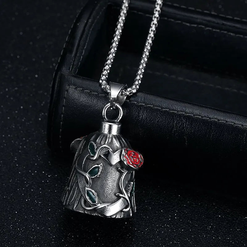 Titanium steel motorcycle lucky bell with vintage polished finish showing double-sided epoxy rose design