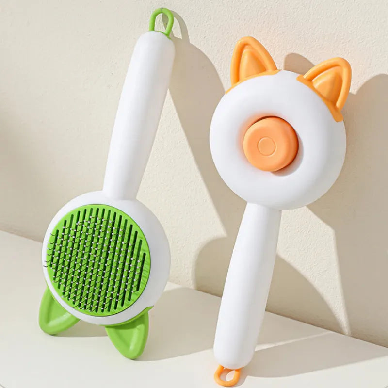 Self-cleaning cat grooming comb with stainless steel teeth and removable brush head in greenish white colour