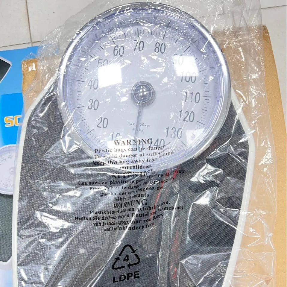 Black mechanical pointer body weight scale showing large dial on 47cm platform