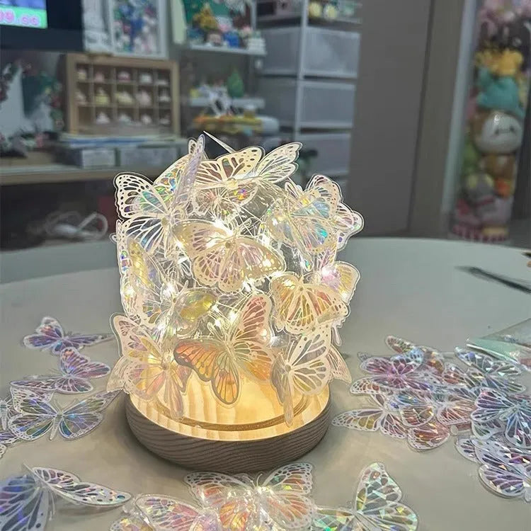 Butterfly-themed DIY night light with glass lampshade on a raw wood base.