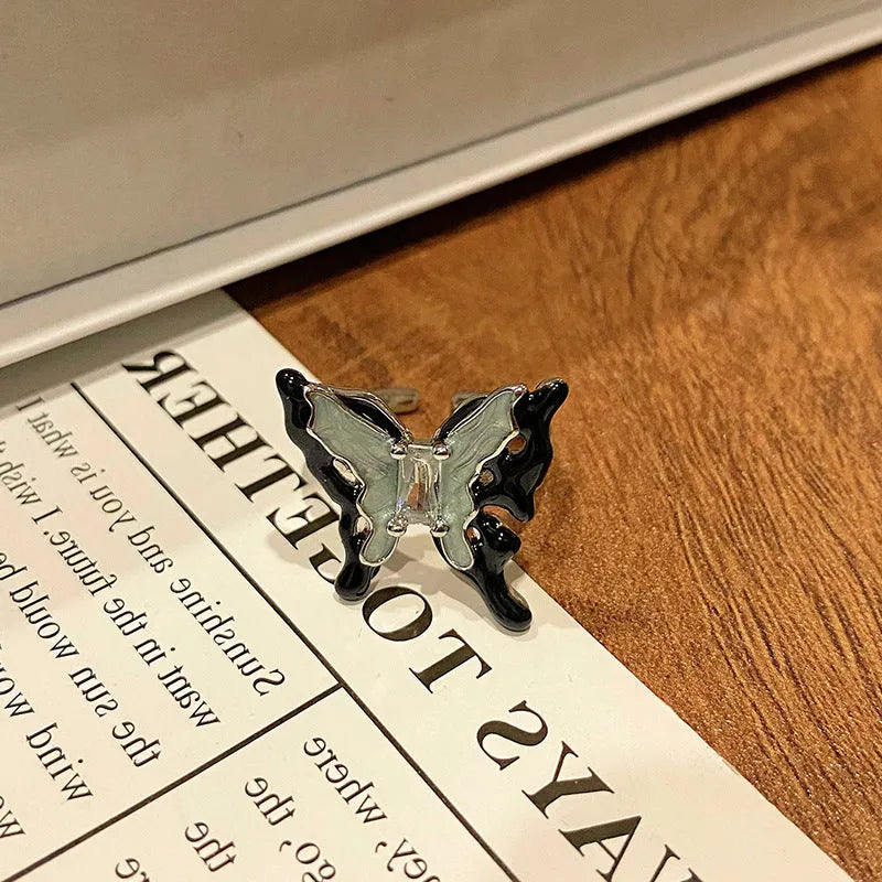 Butterfly women's copper ring with adjustable split ring design showing oil-drip colour treatment