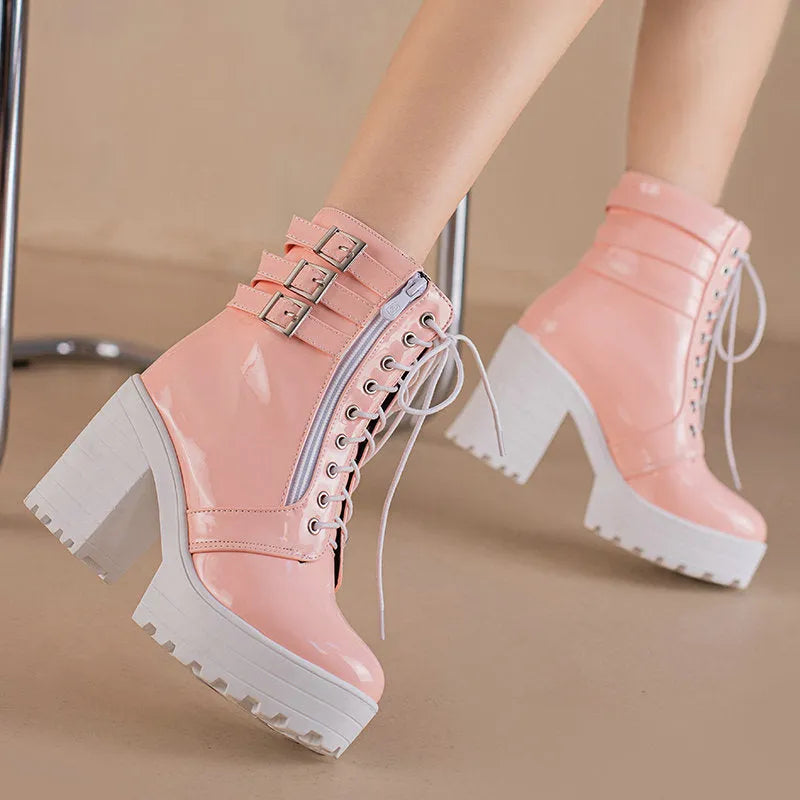 Women's black chunky heel ankle boots with front lace-up and round toe on a waterproof rubber sole.