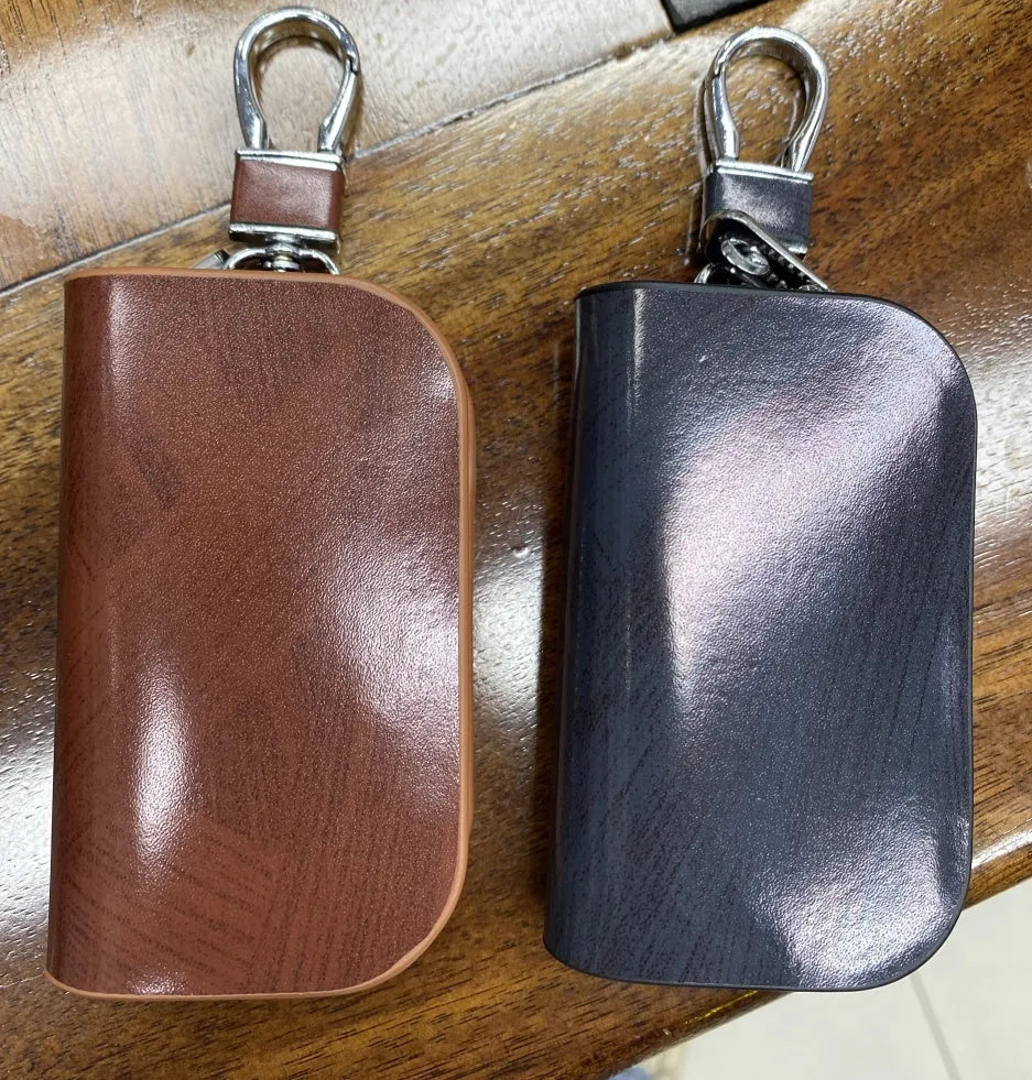 Genuine leather car key case with zipper closure in black or brown colour