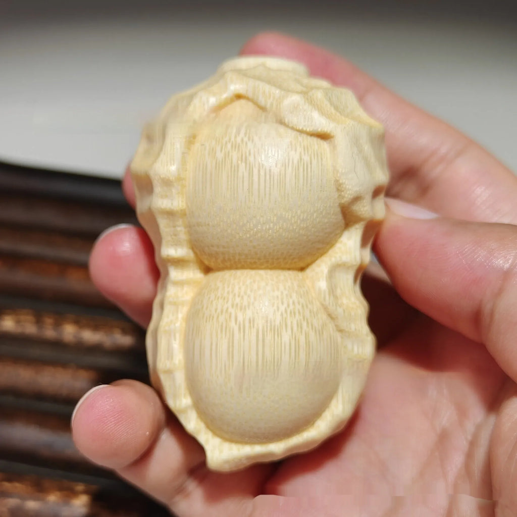 Solid bamboo carving peanut ornament with modern simplicity style and 'May Good Things Happen' message