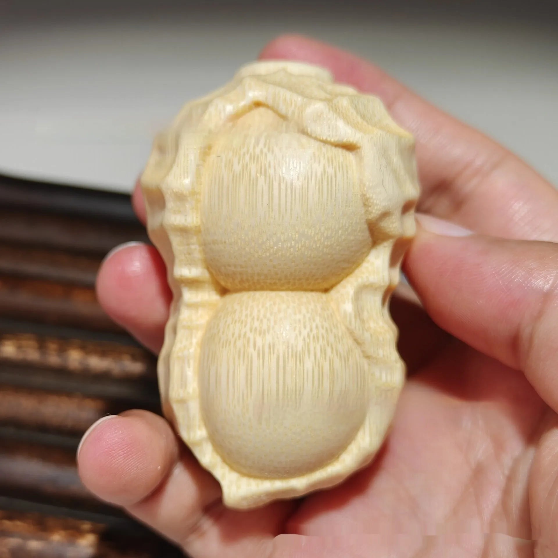 Solid bamboo carving peanut ornament with modern simplicity style and 'May Good Things Happen' message