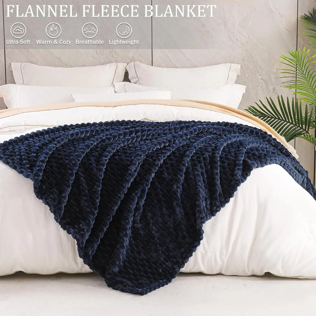 Children's soft plaid polyester blanket in camel colour on a bed
