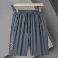 Men's quick-drying nylon sports shorts in black, loose fit with fifth pants length