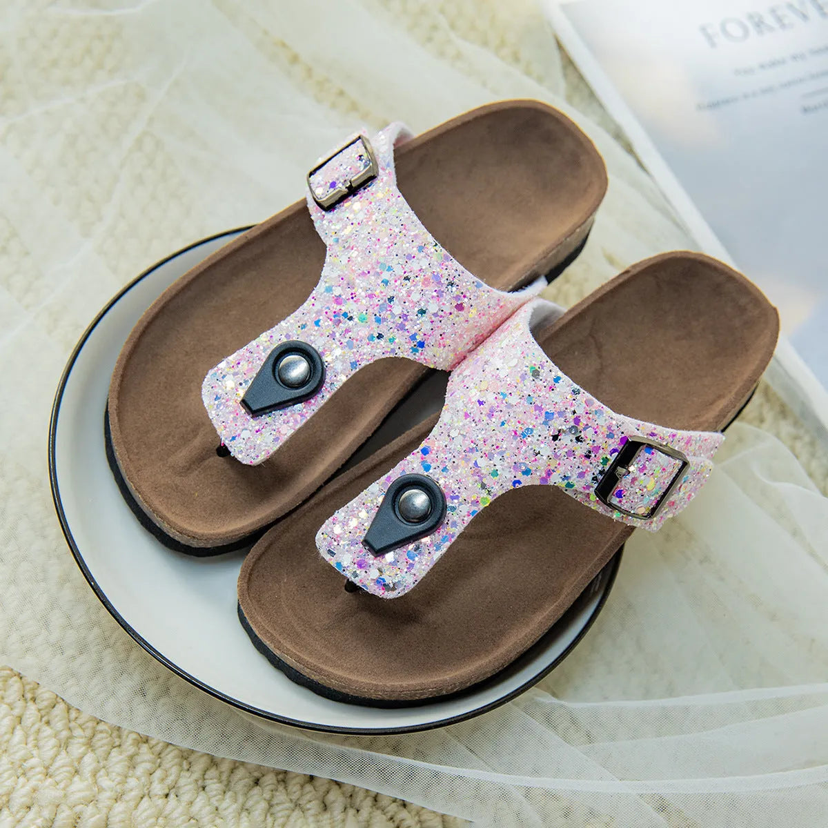 Children's cork flip-flops in gold with a hollow-out design and PVC sole.
