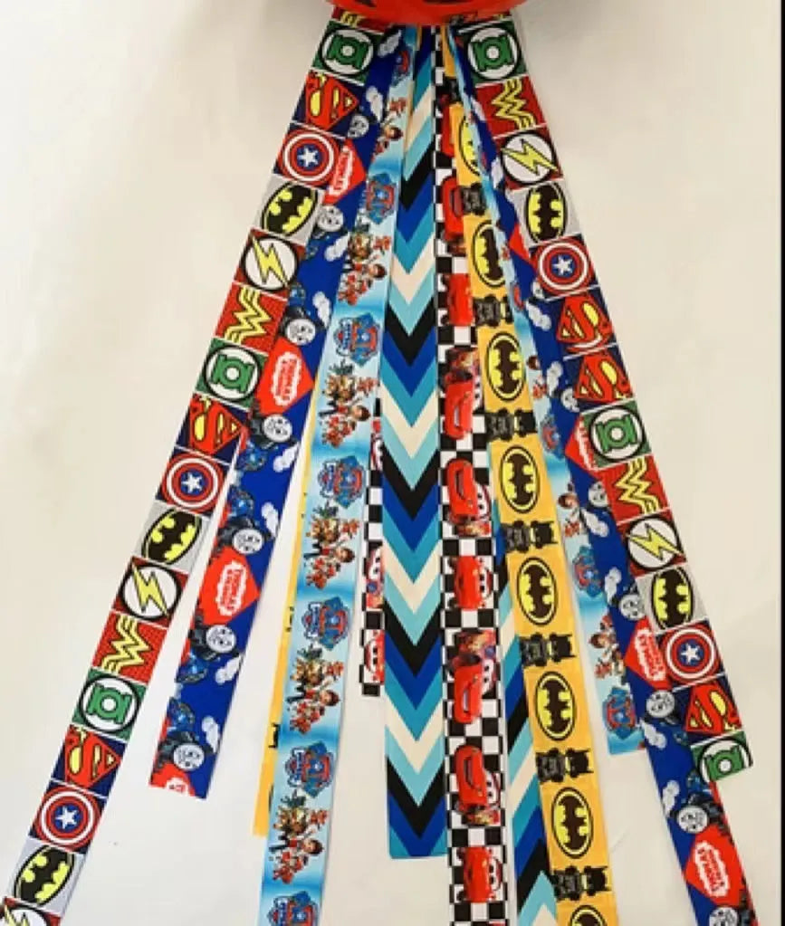 Decorative ribbon streamer for a child's ski or skating helmet in various colour options.
