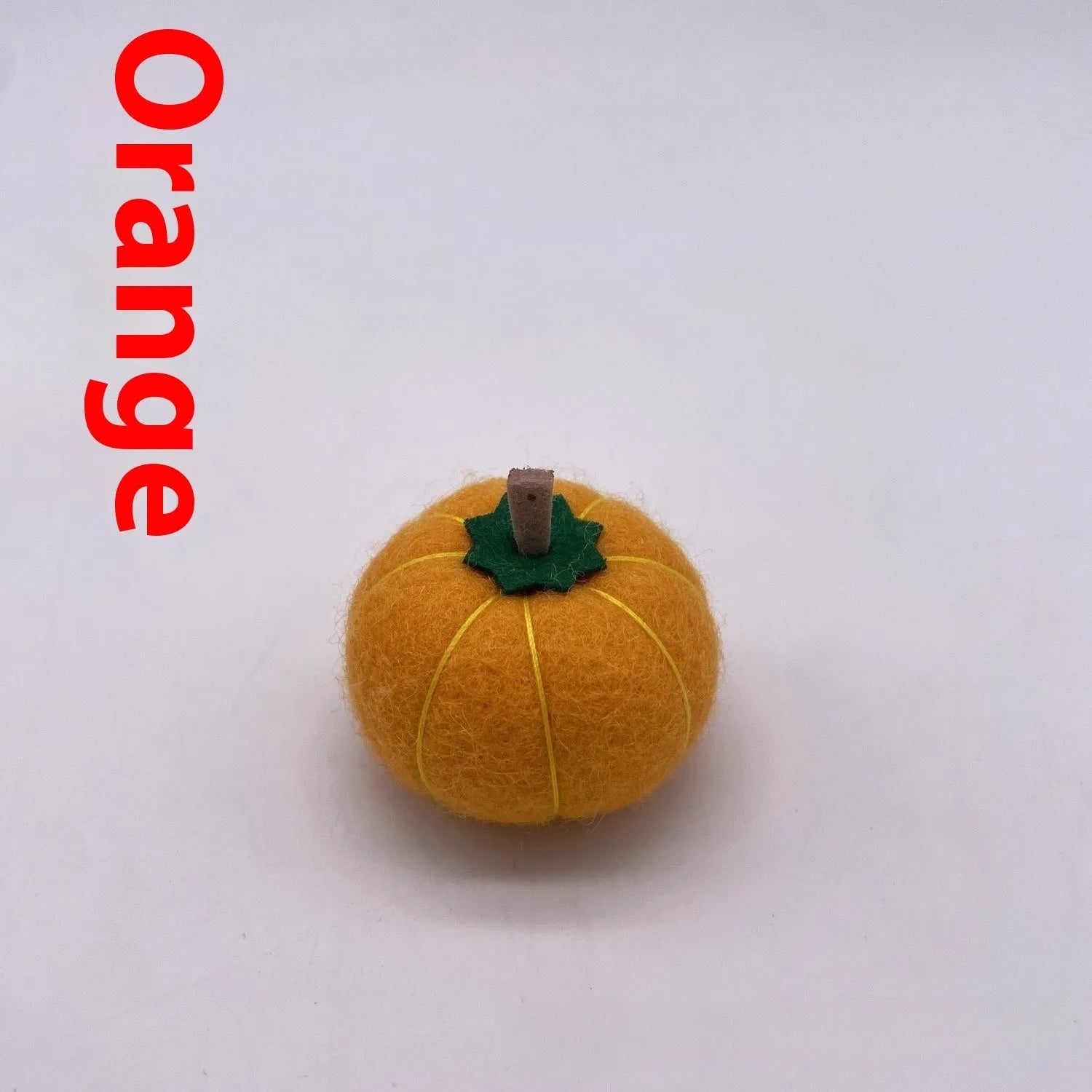 Wool felt pumpkin ornament measuring 5cm diameter in autumn colours for miniature displays
