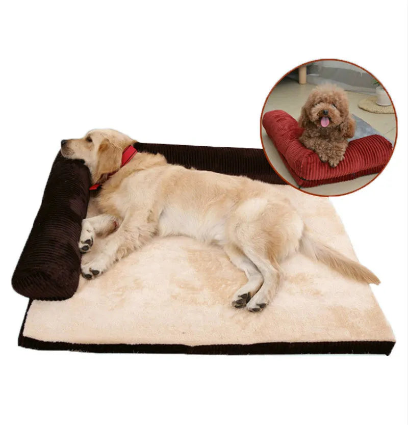 Corduroy dog sofa bed with bolster, shown in grey, placed on a wooden floor.