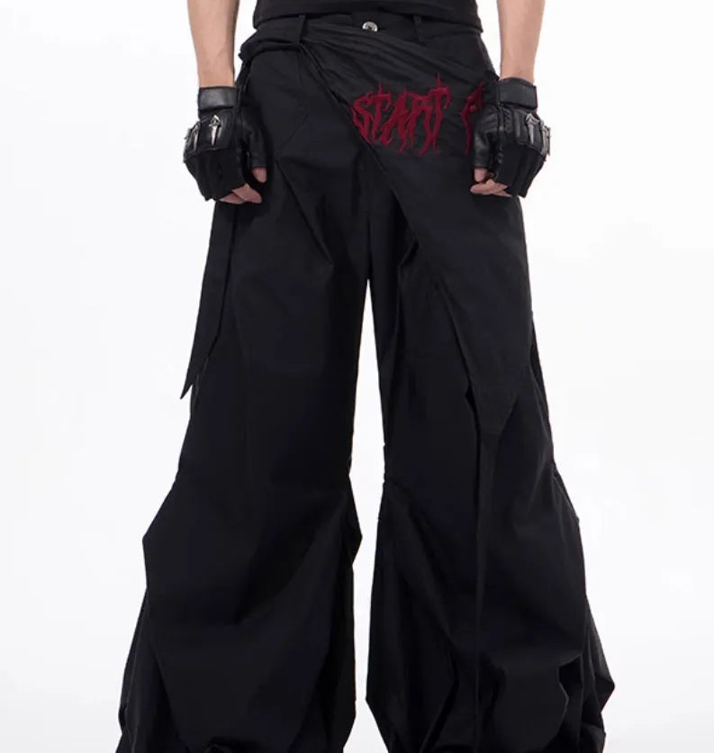 Boy modelling black wide-leg Korean-style casual trousers.