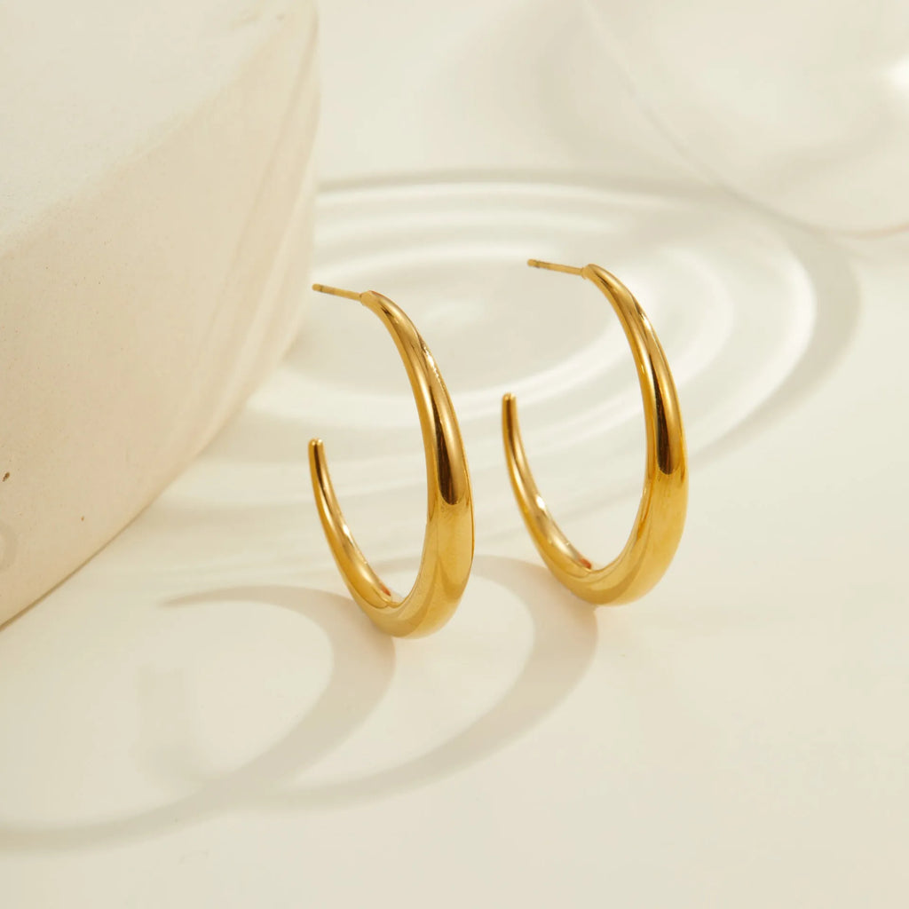 Titanium steel geometric round hoop earrings with gold plating in large and small size options