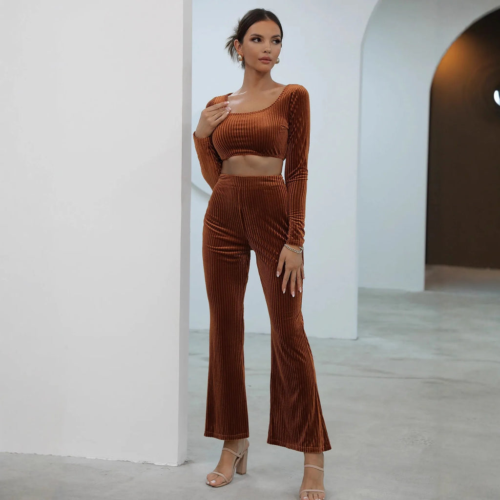 Caramel coloured women's long sleeve sweater set with matching trousers on a hanger.